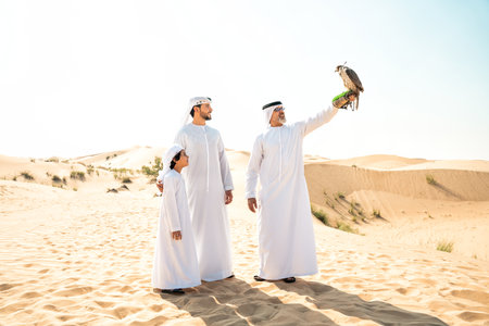 Three generation family making a safari in the desert of Dubai. Grandfather, son and grandson...