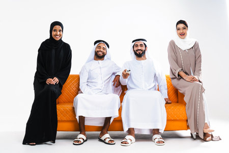Beautiful arab middle-eastern happy group of friends wearing traditional abaya and kandora bonding...