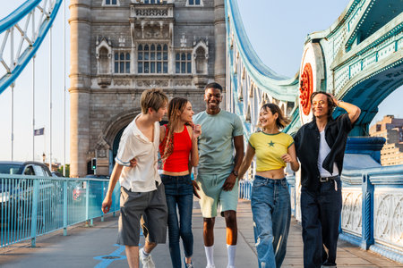 Multiracial group of happy young friends bonding in London city - Multiethnic teens students meeting...