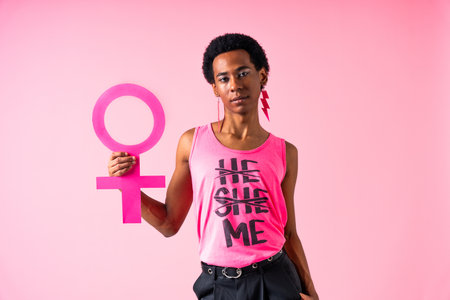 Fluid gender hispanic latin black man posing in studio with fashionable clothing, concepts about...