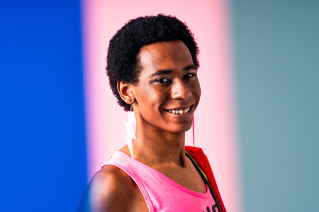 Fluid gender hispanic latin black man posing in studio with fashionable clothing, concepts about LGBTQ, genderless and diversityの写真素材