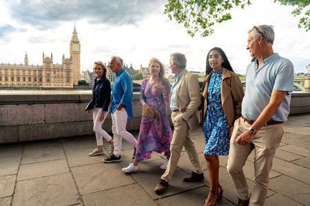 Group of old friends spending time together in the main parts of London, visiting the Westminster area and St. james park. Old buddies reunion. Concept about third age and seniorityの写真素材