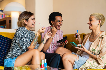 Group of friends bonding at home, LGBTQ and diversity concepts - Homosexual couple and fluid gender non binary young man with cross dressing clothing style having fun in the apartment, LGBT people conceptsの写真素材