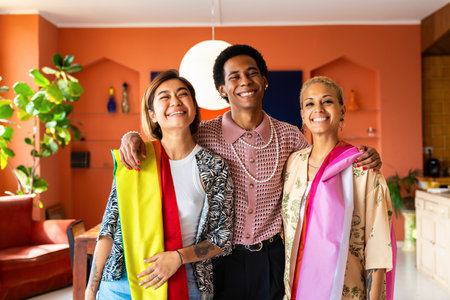 Group of friends bonding at home, LGBTQ and diversity concepts - Homosexual couple and fluid gender non binary young man with cross dressing clothing style having fun in the apartment, LGBT people conceptsの写真素材