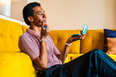 Fluid gender young man wearing cross dressing clothing at home, LGBTQ and diversity concepts -...