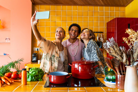 Group of friends bonding at home, LGBTQ and diversity concepts - Homosexual couple and fluid gender non binary young man with cross dressing clothing style having fun in the apartment, LGBT people conceptsの写真素材