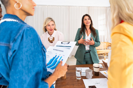 Group of beautiful confident businesswomen meeting in the office - Multiethinc female creative team...