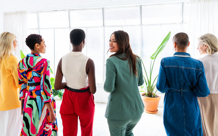 Group of beautiful confident businesswomen meeting in the office - Multiethinc female creative team...