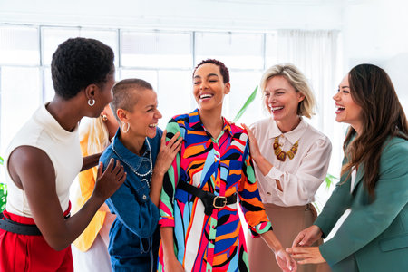 Group of beautiful confident businesswomen meeting in the office - Multiethinc female creative team...