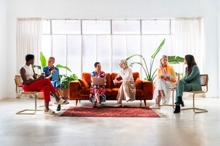 Group of beautiful confident businesswomen meeting in the office - Multiethinc female creative team...