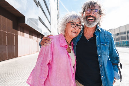 Beautiful happy senior couple bonding outdoors - Cheerful old people romantic dating in the city, concepts about elderly and lifestyleの写真素材