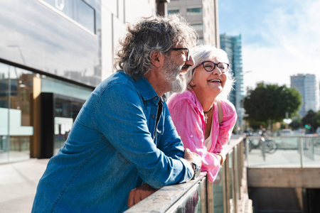 Beautiful happy senior couple bonding outdoors - Cheerful old people romantic dating in the city, concepts about elderly and lifestyleの写真素材