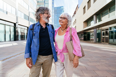 Beautiful happy senior couple bonding outdoors - Cheerful old people romantic dating in the city, concepts about elderly and lifestyleの写真素材
