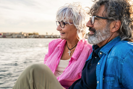 Beautiful happy senior couple bonding outdoors - Cheerful old people romantic dating in the city, concepts about elderly and lifestyleの写真素材