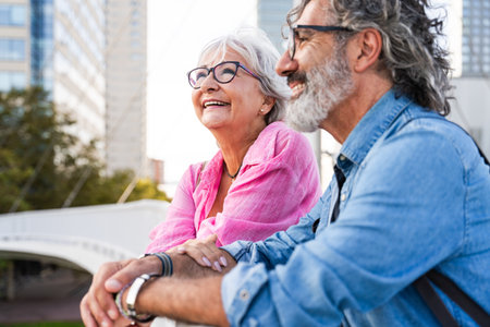 Beautiful happy senior couple bonding outdoors - Cheerful old people romantic dating in the city, concepts about elderly and lifestyleの写真素材