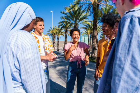 Multiethnic group of young happy friends hanging out in the city - Multiracial group of students...
