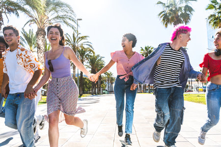 Multiethnic group of young happy friends hanging out in the city - Multiracial group of students...