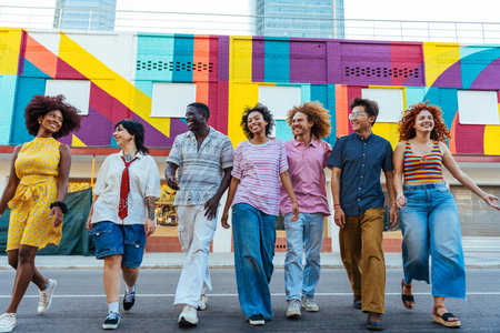Multiethnic group of young friends meeting and having fun outdoors - Multiracial happy and stylish teen students bonding in the city, concepts about youth, teenagers lifestyle and diversityの写真素材
