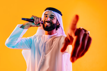 Arab businessman wearing emirates kandura portrait in studio in Dubai - Handsome middle eastern male...