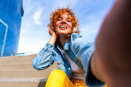 Portrait of cheerful and beautiful young girl with red hair strolling outdoors - Pretty female teen...