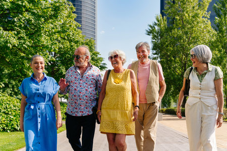 Group of senior friends meeting outdoors in the city and having fun - Cheerful old people bonding together, concepts about elderly, quality of life and aging lifestyleの写真素材