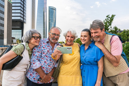 Group of senior friends meeting outdoors in the city and having fun - Cheerful old people bonding together, concepts about elderly, quality of life and aging lifestyleの写真素材