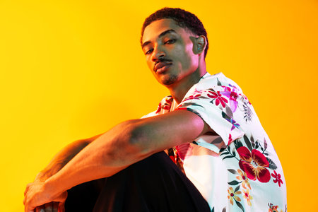 African man young portrait in studio on colorful background - Cool black young male with stylish...