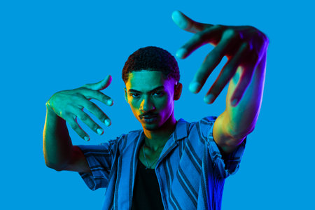 African man young portrait in studio on colorful background - Cool black young male with stylish...