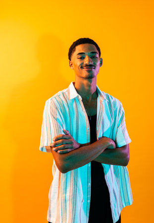 African young man portrait in studio on colorful background - Cool black young male with stylish...