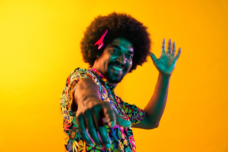 African man portrait in studio on colorful background - Cool black young male with stylish attire...
