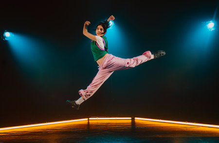 Hip hop dancer dancing in a cool studio with neon lights.の写真素材