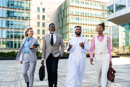 Group of multiethnic business people meeting an emirate businessman - International corporate business team bonding outdoors in the cityの写真素材