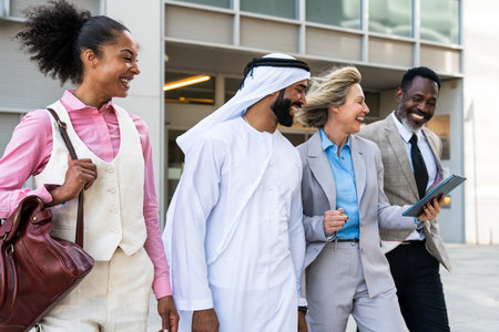 Group of multiethnic business people meeting an emirate businessman - International corporate business team bonding outdoors in the cityの写真素材