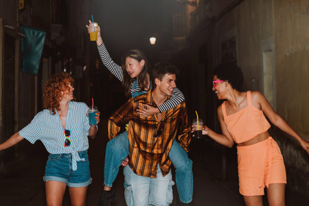 Friends going out in the evening and having party. Young people meeting outdoors in the weekend and...