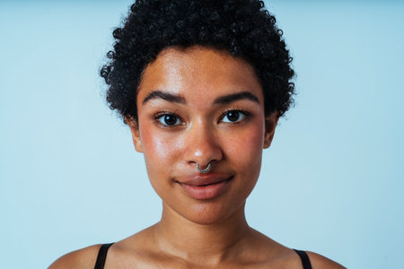 Black afro woman wearing lingerie posing for body positive concepts -Pretty female young adult not shaved on armpit posing for body acceptance, diversity, self-esteemの写真素材