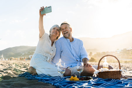 Beautiful happy senior couple at the seaside during summertime - Mature married couple in love...