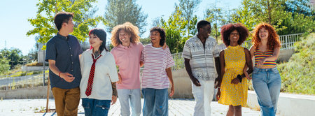 Multiethnic group of young friends meeting and having fun outdoors - Multiracial happy and stylish teen students bonding in the city, concepts about youth, teenagers lifestyle and diversityの写真素材