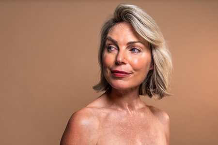 Beauty portrait of beautiful mature woman, concepts about cosmetics, skincare and wellness. Studio portrait of a beautiful mature woman with bare shouldersの写真素材