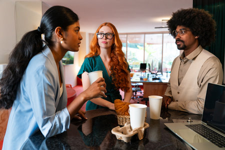 Multiethnic small group of businesspeople meeting in a coworking corporate company office - Young coworkers colleagues working together in a creative startup tech company, concepts about business and daily office lifestyleの写真素材