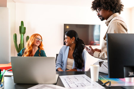 Multiethnic small group of businesspeople meeting in a coworking corporate company office - Young coworkers colleagues working together in a creative startup tech company, concepts about business and daily office lifestyleの写真素材
