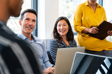 Startup business team members are discussing new strategies during a productive meeting in a modern...