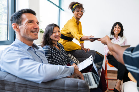 Startup business team collaborating and sharing information during a productive meeting in a modern...