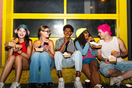Multiethnic group of young friends having fun on the streets in the night - Stylish cool multiracial...