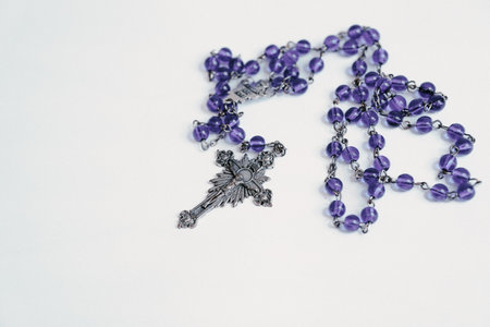 Rosary on plain white backgroundの写真素材