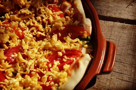 pizza and ingredients for pizza on the wooden backgroundの写真素材