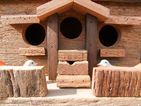Wooden postal boxes and birdsの写真素材