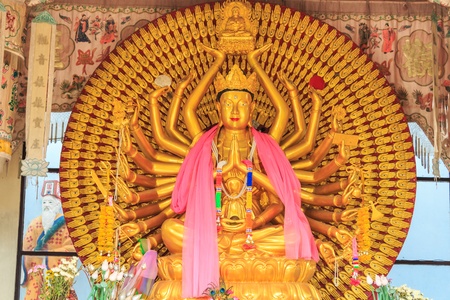 Golden Statue of Guan Yin with thousand handsの写真素材