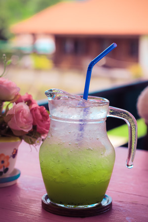 Kiwi juice with soda on natural background (vintage style)の写真素材