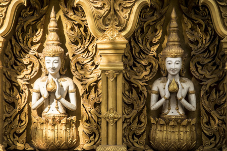 Buddha standing in the temple Wall