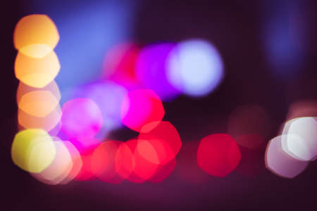 Abstract background with blurred lights from traffic lightの写真素材